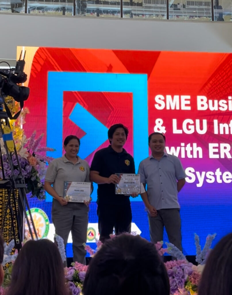 Project Showcase at the 2023 Start-Up Event in Biñan, Laguna: From left to right, Ms. Pauline Flores, Design Officer; Mr. Caezar De Castro II, CEO and Software Engineer; and Atty. Edwardvange Arriba, President of Biñan BPLO.